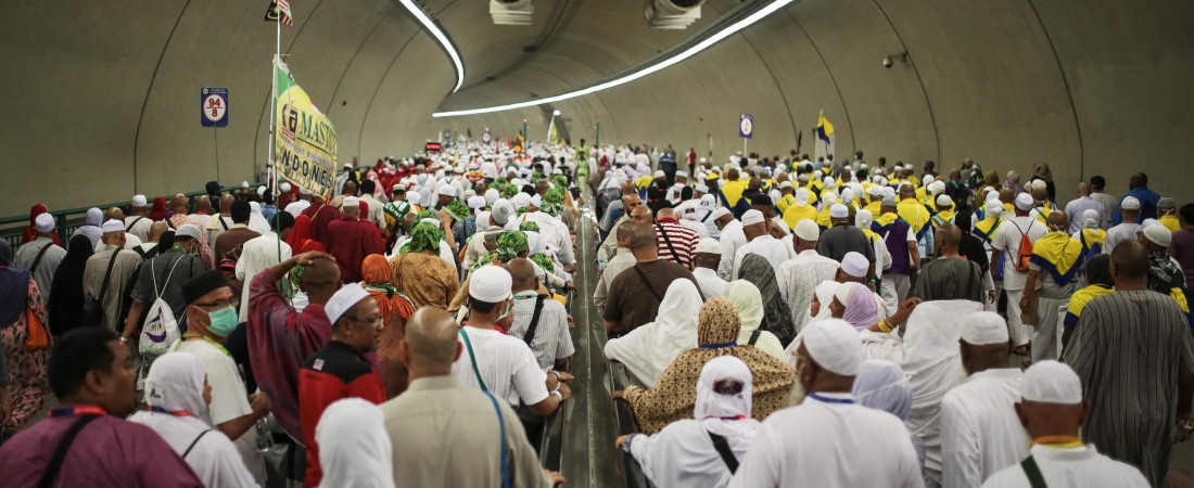 Muslim pilgrims walk in a tunnel on their way to cast stones at Jamarrat pillars, a ritual that symbolises the stoning of Satan, during the annual pilgrimage, known as the hajj, in Mina, near the holy city of Mecca, Saudi Arabia, Friday, Sept. 25, 2015. (AP Photo/Mosa'ab Elshamy)