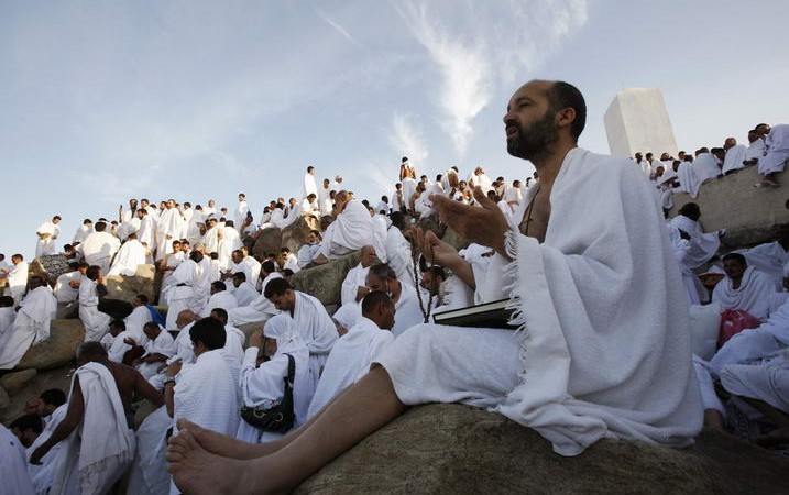 A Muslim pilgrim prays on Mount Mercy on the plains of Arafat outside the holy city of Mecca December 7, 2008. More than two million Muslims began the haj pilgrimage on Saturday, heading to a tent camp outside Mecca to follow the route Prophet Mohammad took 14 centuries ago. REUTERS/Ahmed Jadallah (SAUDI ARABIA)